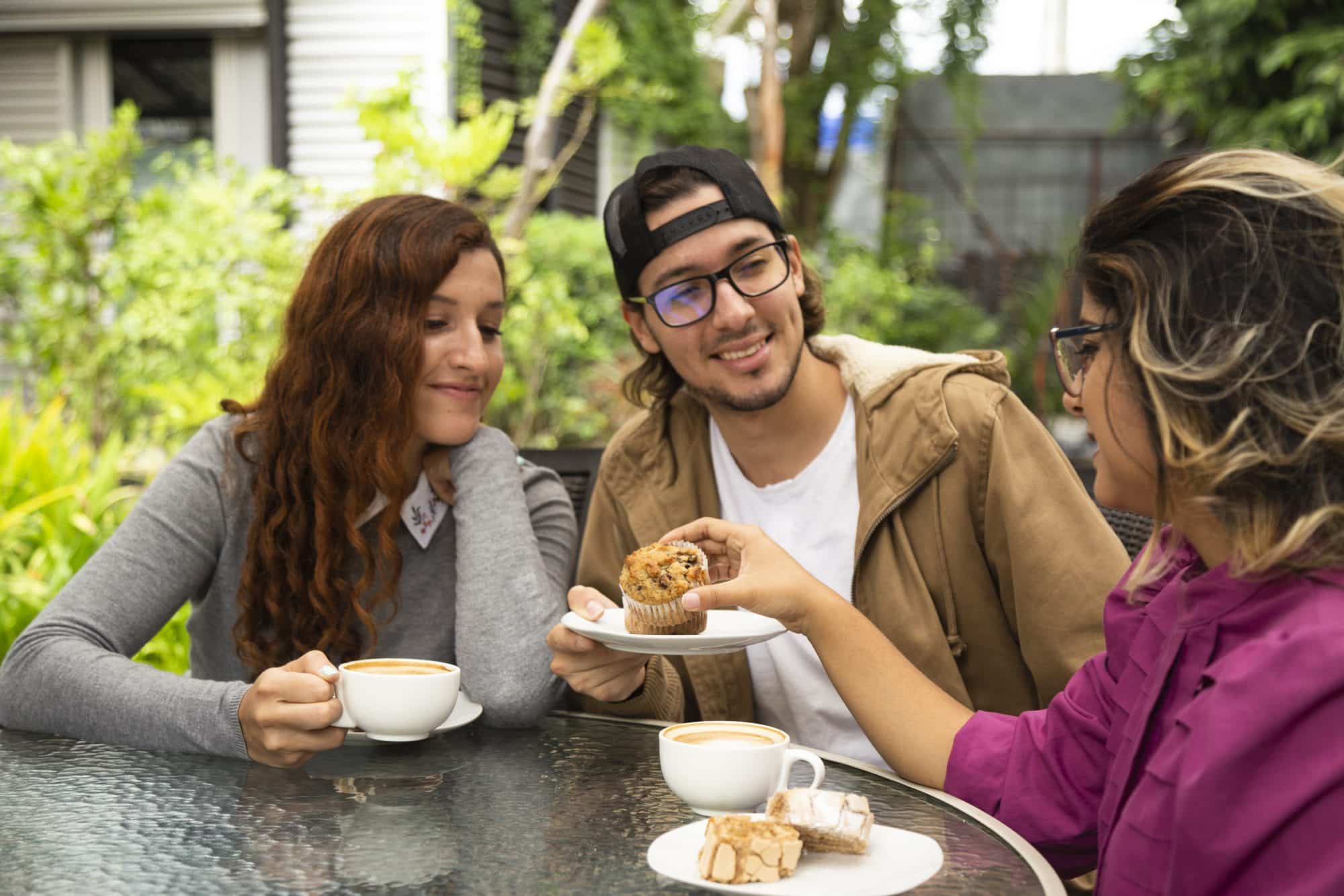 The Best Walkable Apartments Near Austin’s Top Restaurants and Cafes - medium shot of friends drinking coffee.