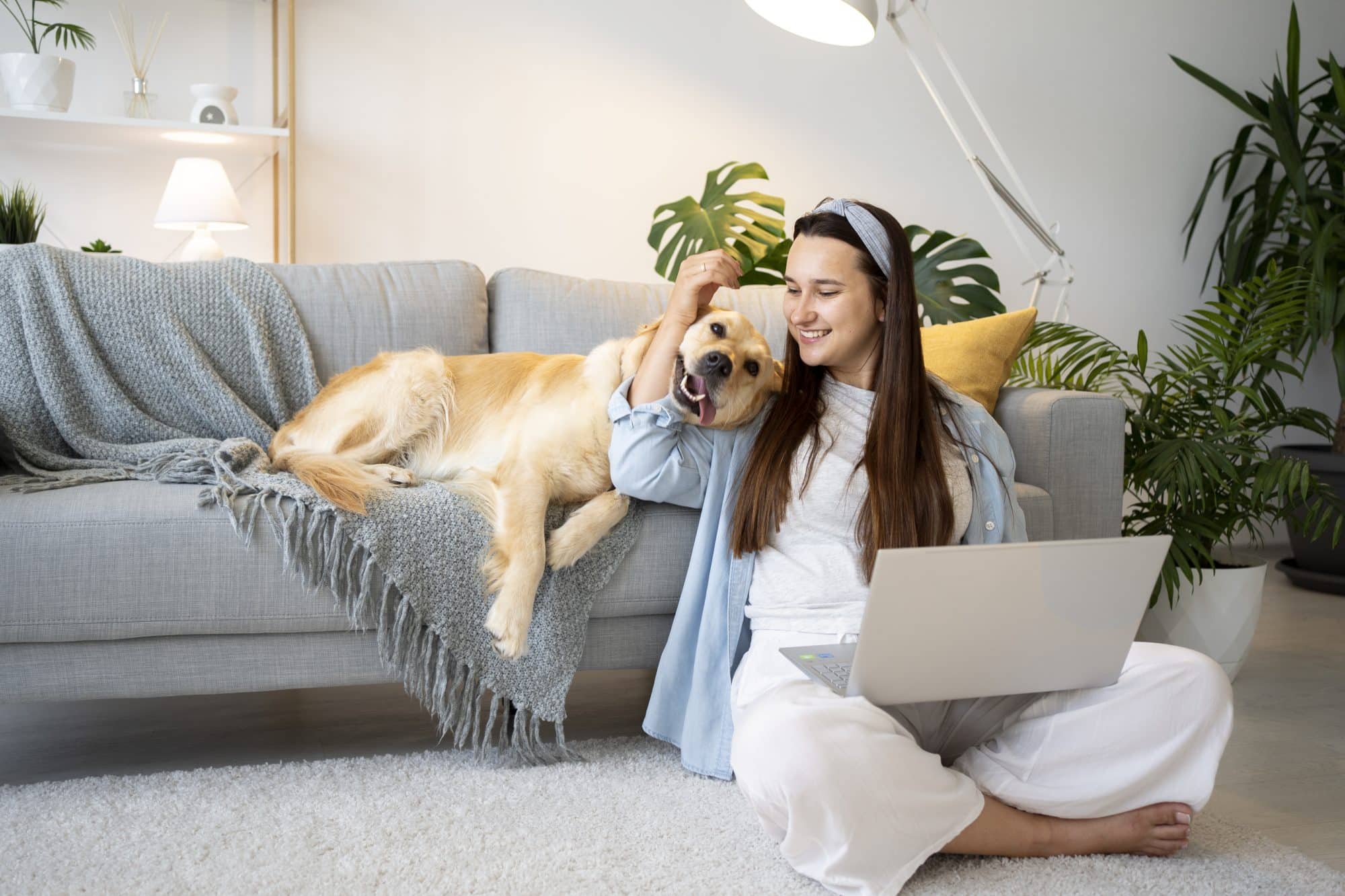 The Unspoken Happiness: Why Your Pet Loves Living at The Johnny - Full shot of a woman and a cute dog at home.
